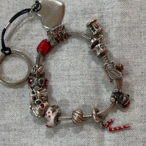 Pandora charm bracelet with 10 charms and 2 spacers